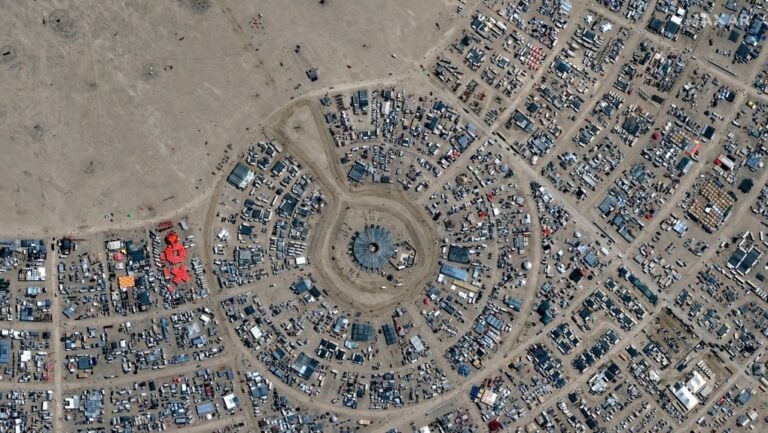 A tribal ranger swings his gun at climate activists blocking the road to Burning Man; behavior under review
